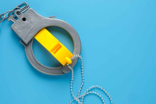 What are the legal considerations for UK businesses with regards to employee whistleblowing in foreign subsidiaries?